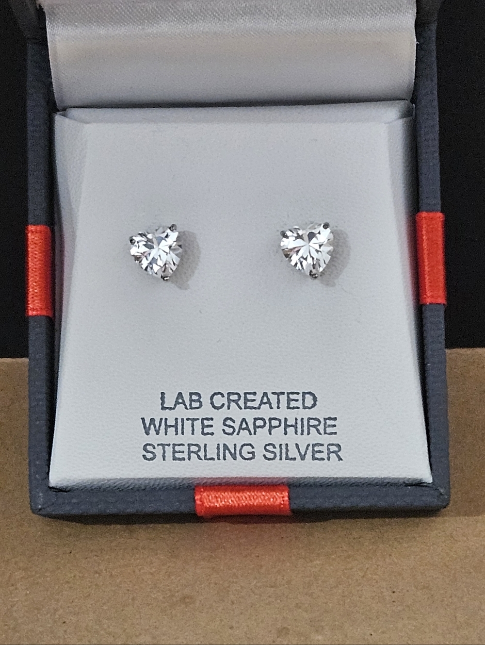 Sterling silver lab created white sapphire Heart shaped earrings. New in Box.